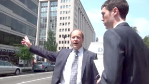 Watch a Greenpeace Activist Confront a Coal Lobbyist as He Fails to Catch a Cab