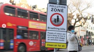 Teenage Activists Post Signs to Warn of Toxic Air in London Neighborhoods