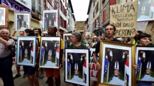 French Activists Face Charges for Stealing Portraits of Macron