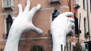 Giant Hands Rise From Venice Canal, Sends Alarming Message of Sea Level Rise