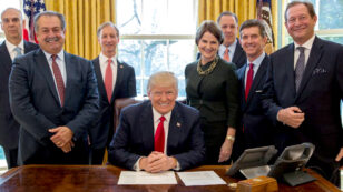 Trump Gives Pen to Dow Chemical CEO After Signing Executive Order to Eliminate Regulations