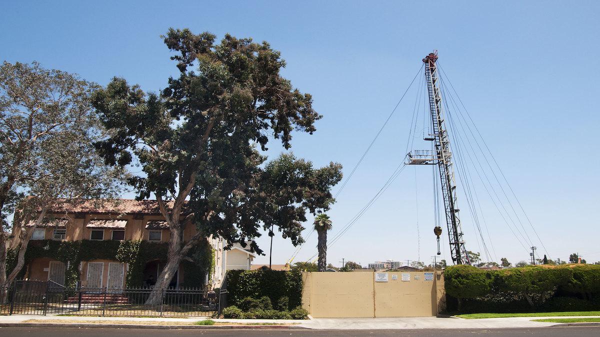 ​A house in Los Angeles next to an oil drilling site.