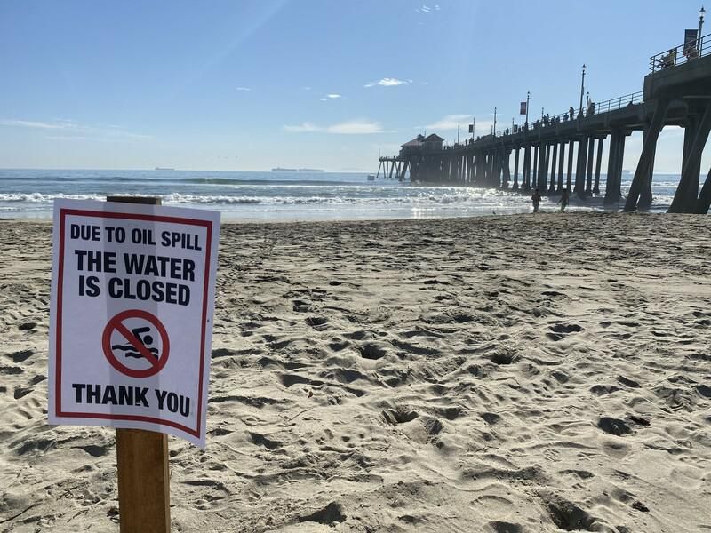 A sign at Huntington Beach warns against entering the water.