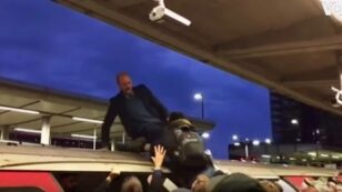 Climate Protester Dragged From Top of Train by London Commuters