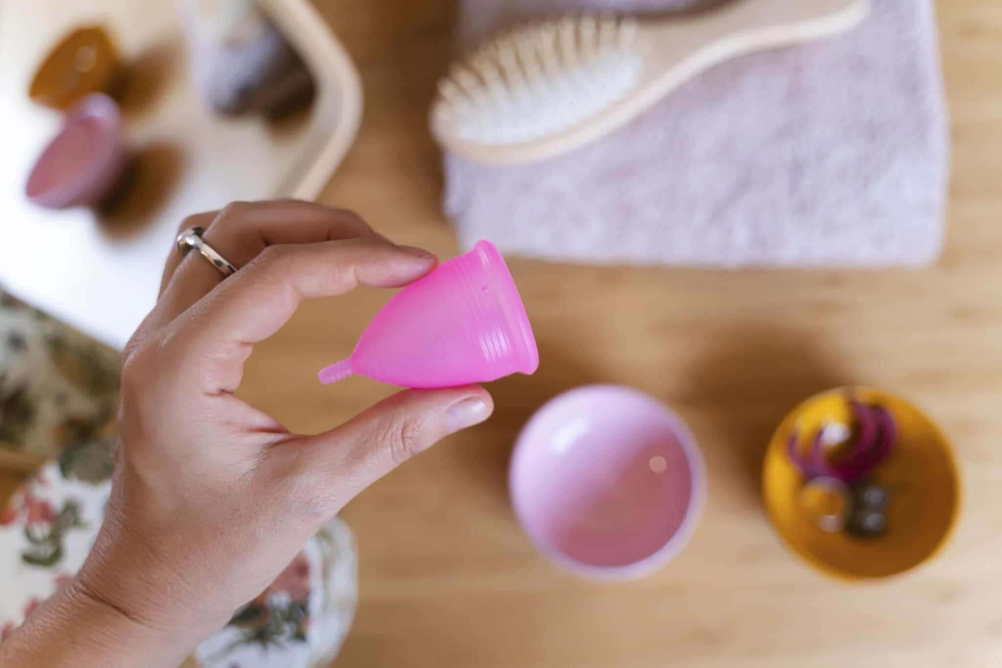 Woman holding a menstrual cup