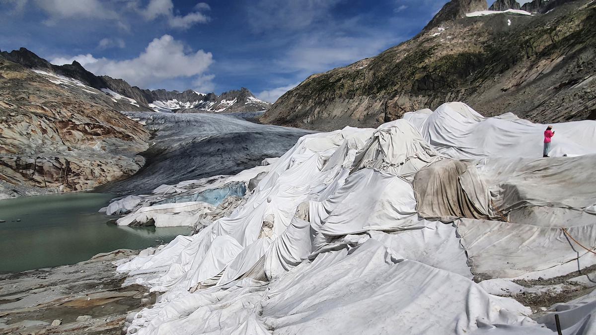 ​Switzerland's Rhone Glacier protected by white tarps.