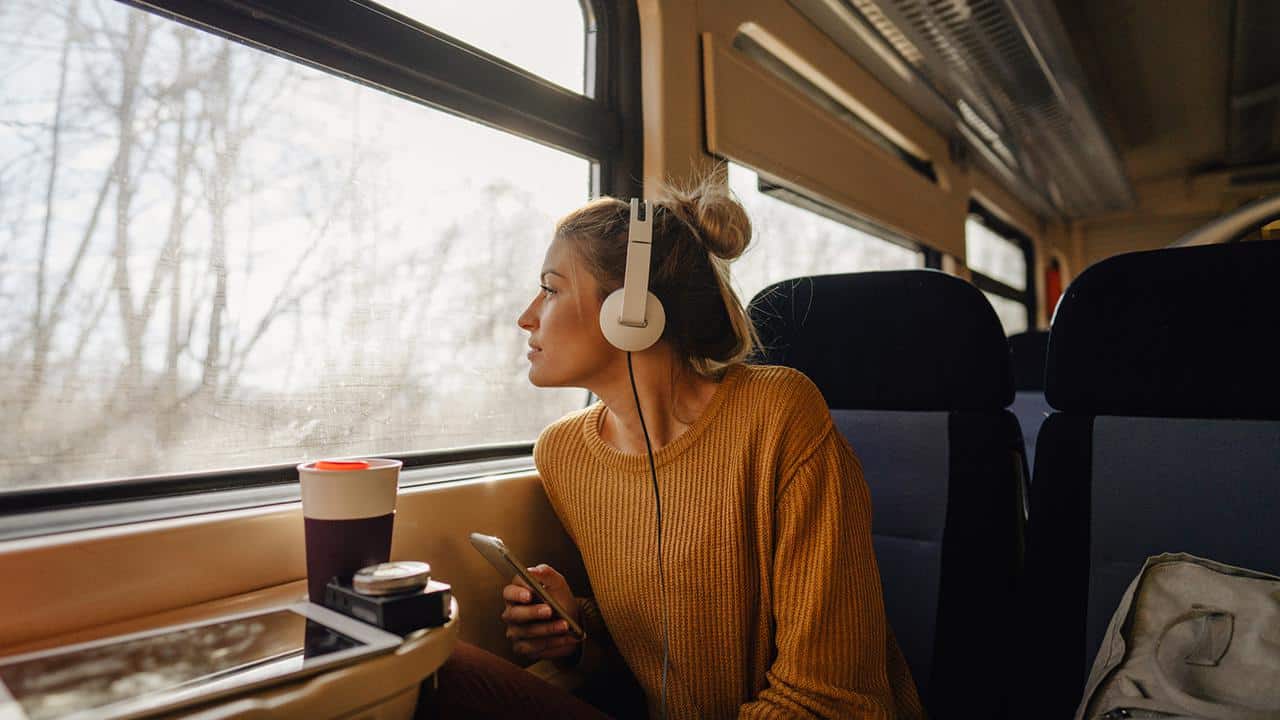 Young woman riding a train