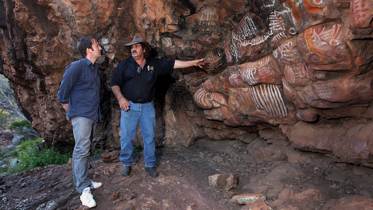 Indigenous guide Terence Coulthard shows chef Rene Redzepi ancient rock art in Australia.