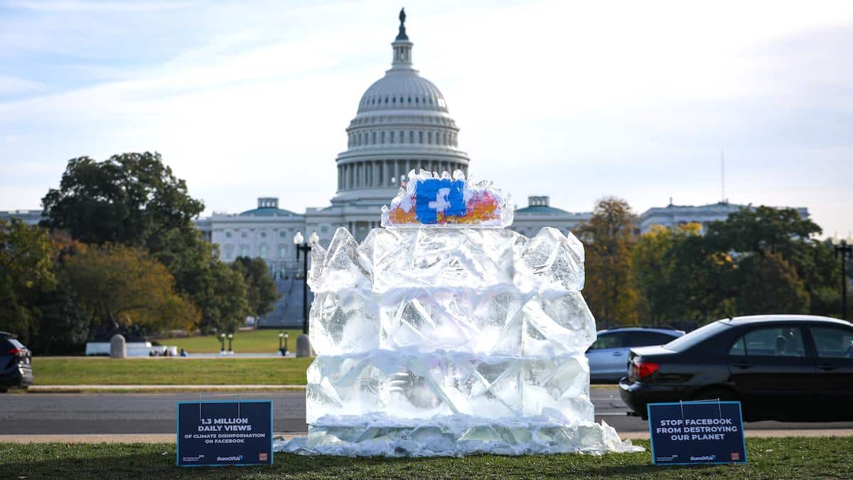 <wbr /><wbr />Climate activists protest the spread of climate disinformation on Facebook, with an ice sculpture in front of the U.S. Capitol.