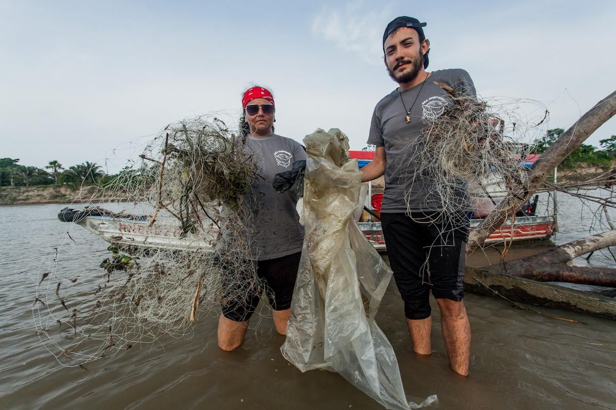 Sea Shepherd researchers with plastic and netting found on an expedition.