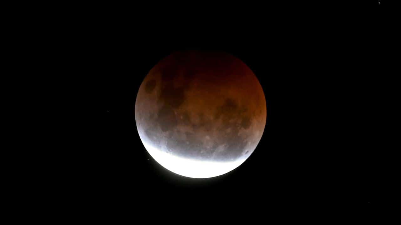 The full blood super moon is seen during the partial eclipse