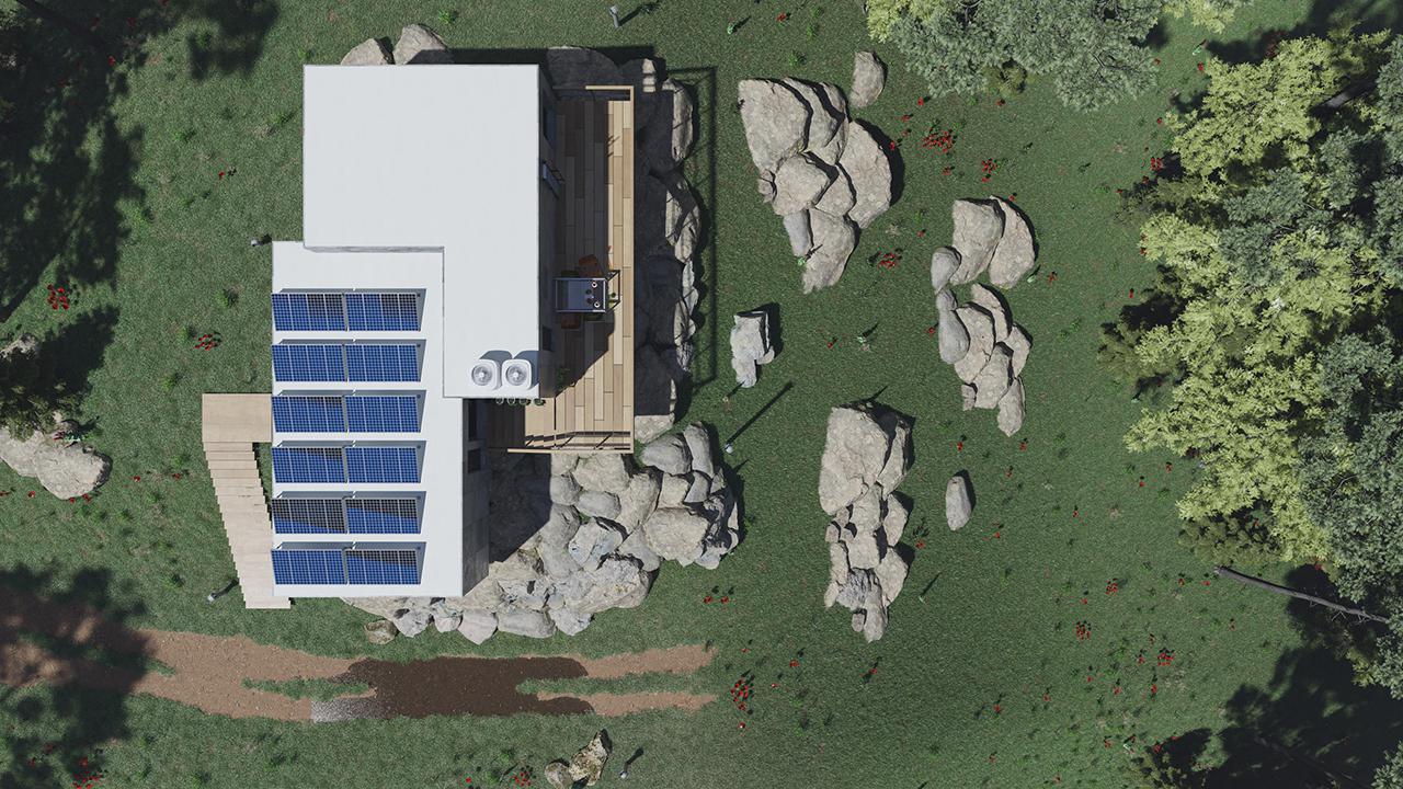 Top View of a Concrete House with Solar Panels and a Balcony