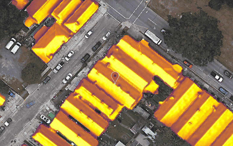 Solar irradiance maps show an aerial view of a street and homes with yellow roofs