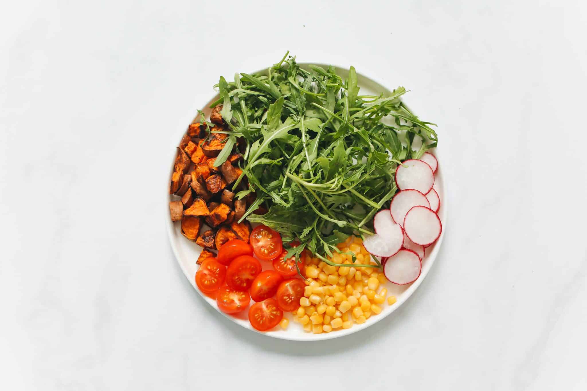 arugula salad on white background