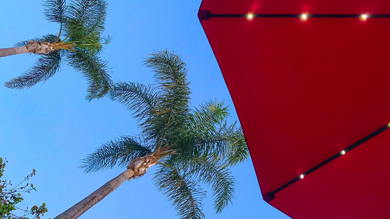 Red beach umbrella with solar lights