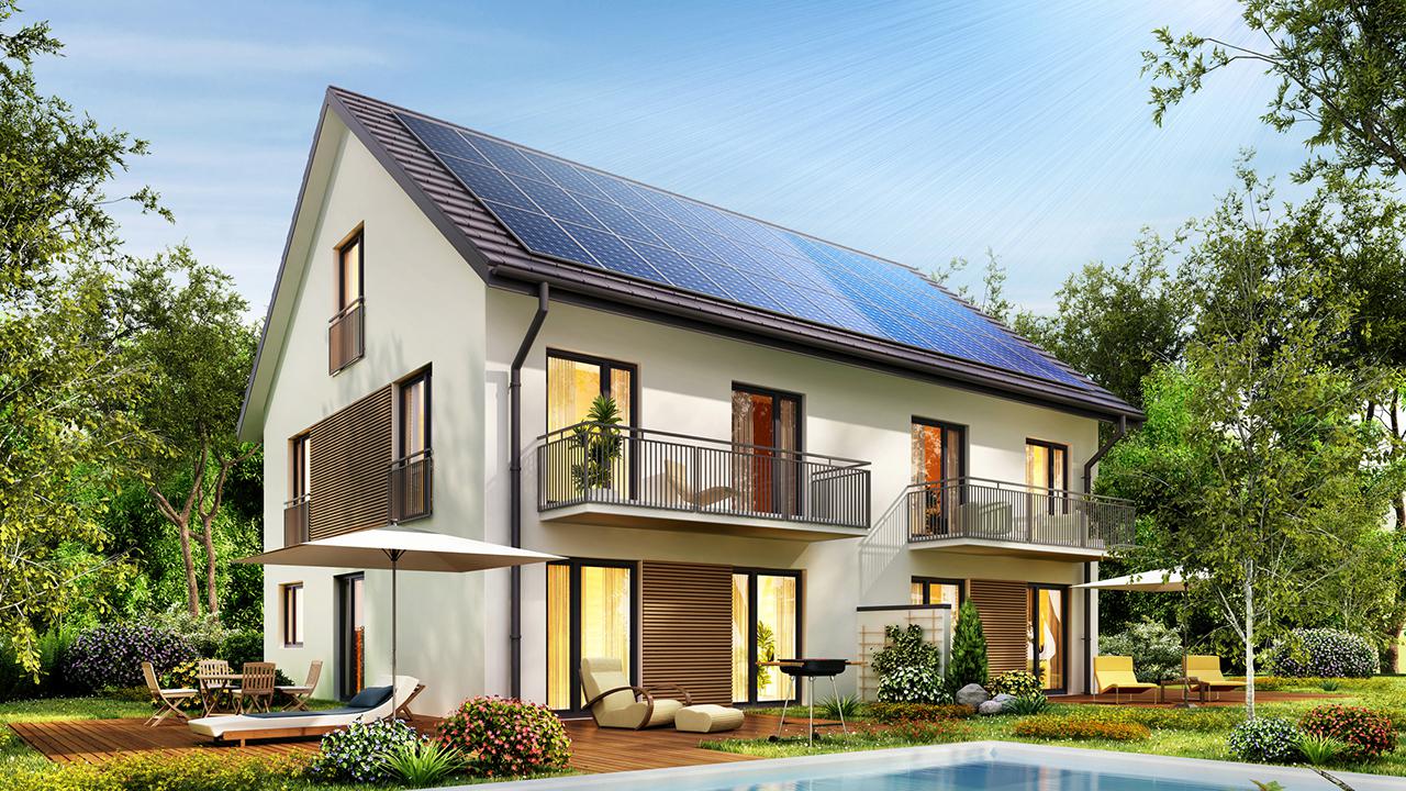 Townhouse with solar panels on the roof and a terrace and swimming pool