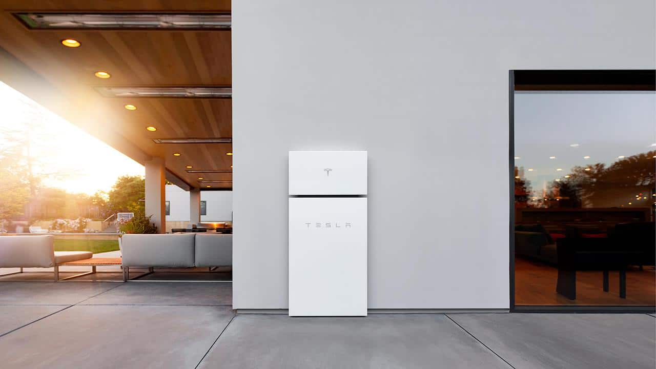 Side of home with Tesla Powerwall+ battery