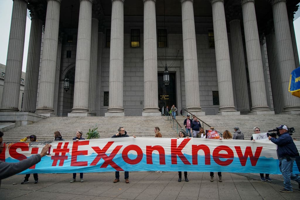 Environmental Activists Protest Outside Exxon Fraud Trial
