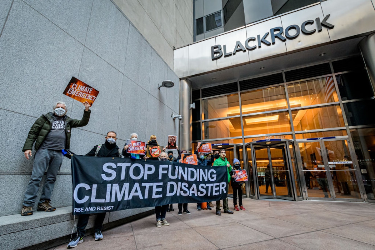 Climate activists protest against BlackRock's fossil fuel investments.