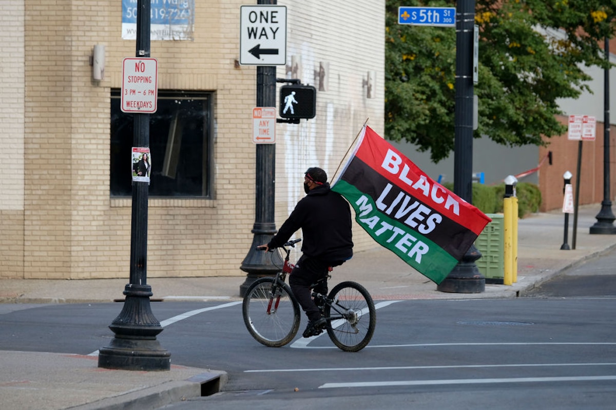 A Black cyclist in downtown Louisville, Kentucky