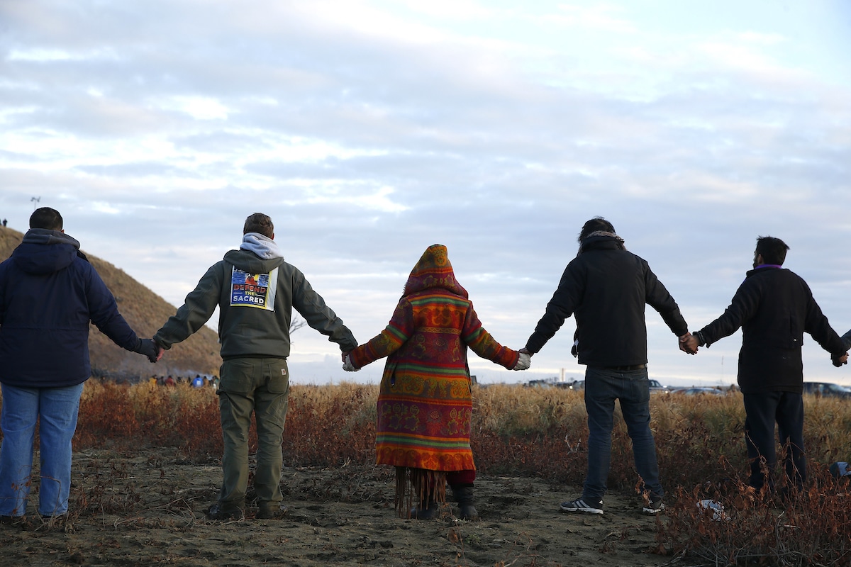 Dakota Access Pipeline protestors join hands at Standing Rock