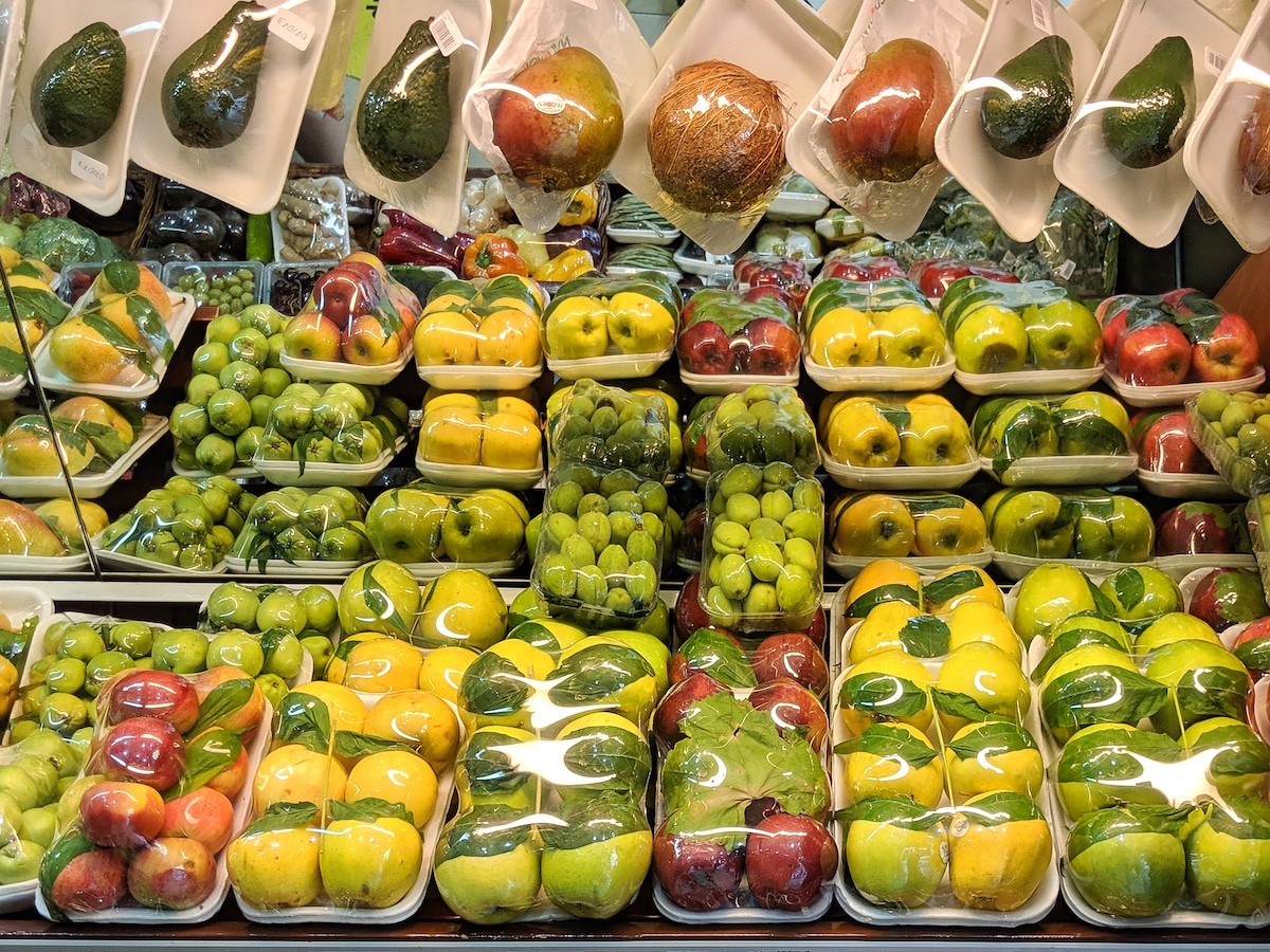 Fruits and vegetables wrapped in plastic