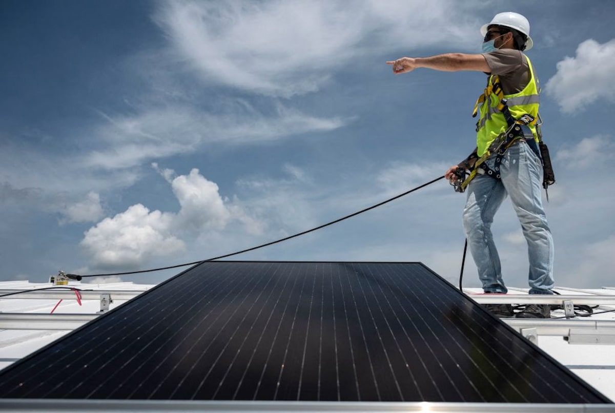 Solar panels being installed on a roof in Virginia.