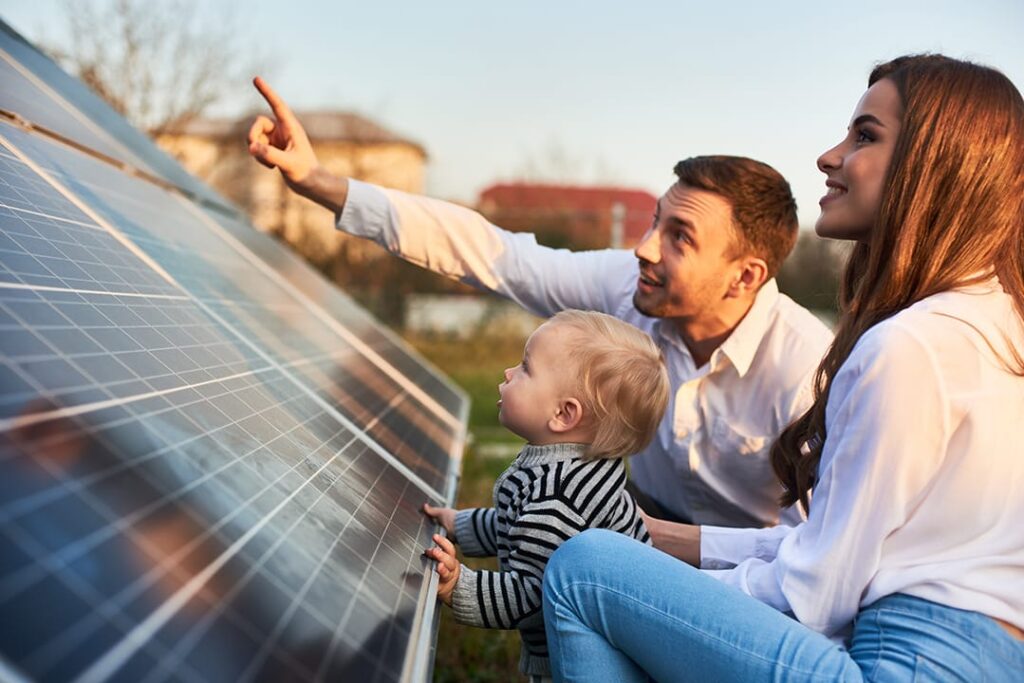 family looking at a solar panel deciding where to buy solar panels