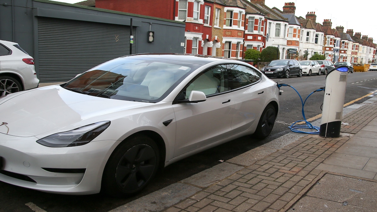 A Tesla electric car using an EV charging point in London