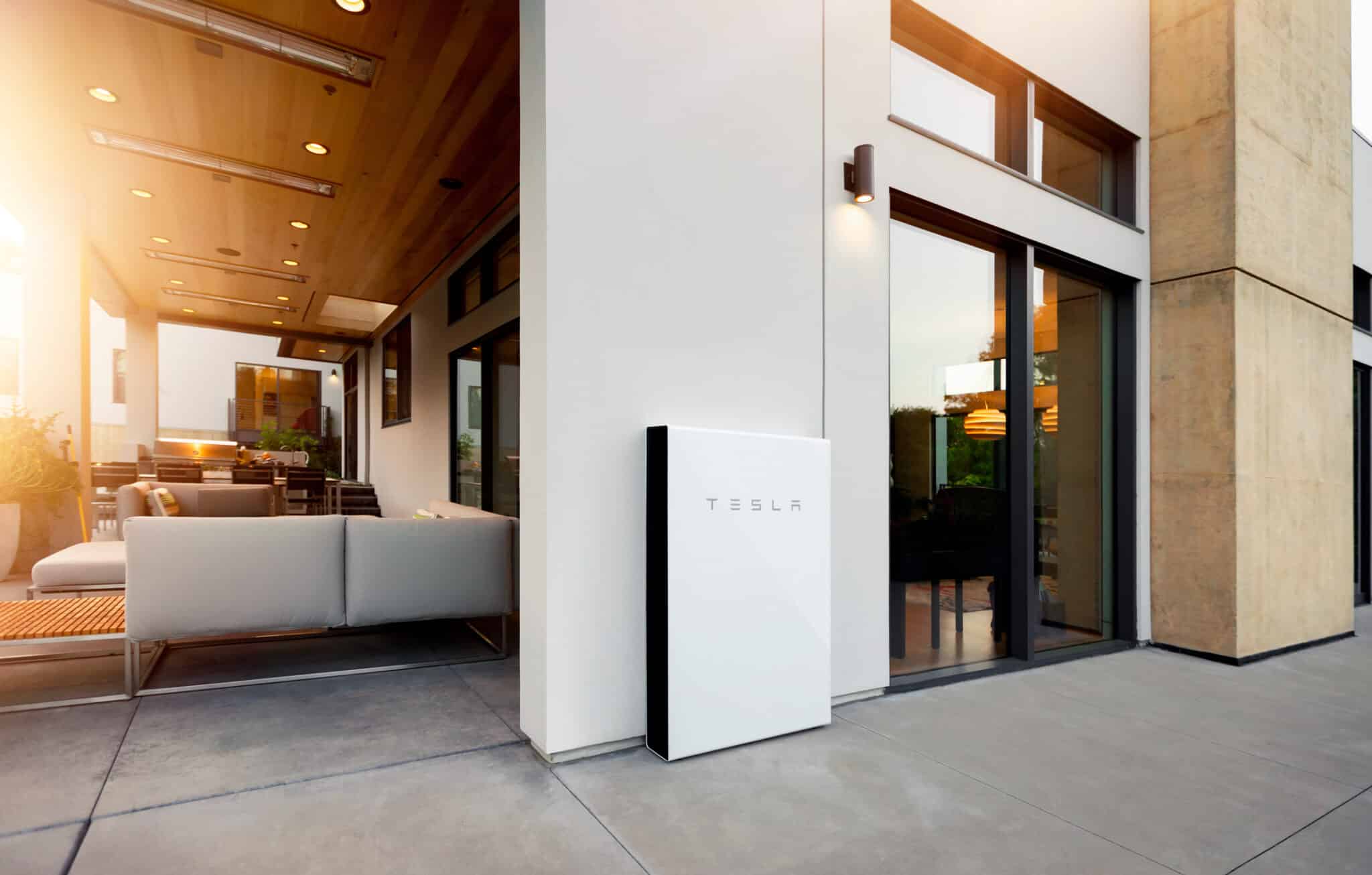 Tesla powerwall battery against outer wall of house