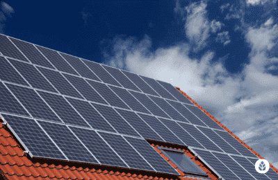 solar panels lined up on brick tile roof