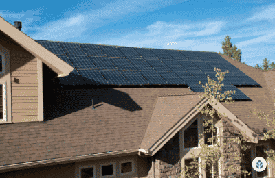 many solar panels installed on a big house