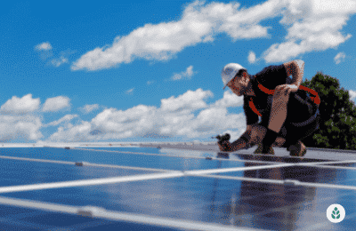 man checking if solar panels are properly aligned