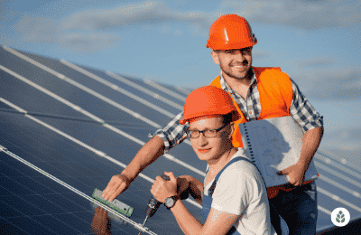inspector and solar installer checking solar panels