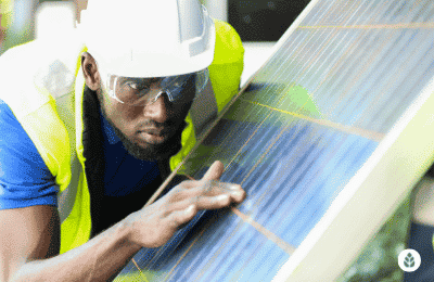 man inspecting details of a solar panel