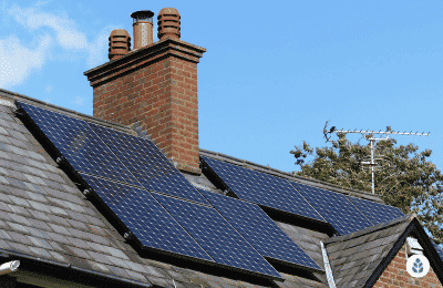 solar panels installed next to a chimney