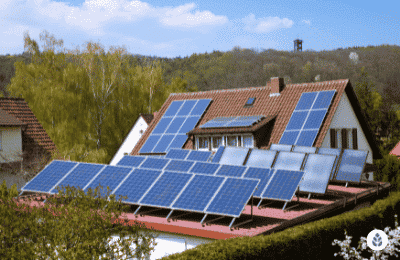 plenty of solar panels installed on a house roof