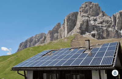 solar panels on a rural house overlooking the mountains