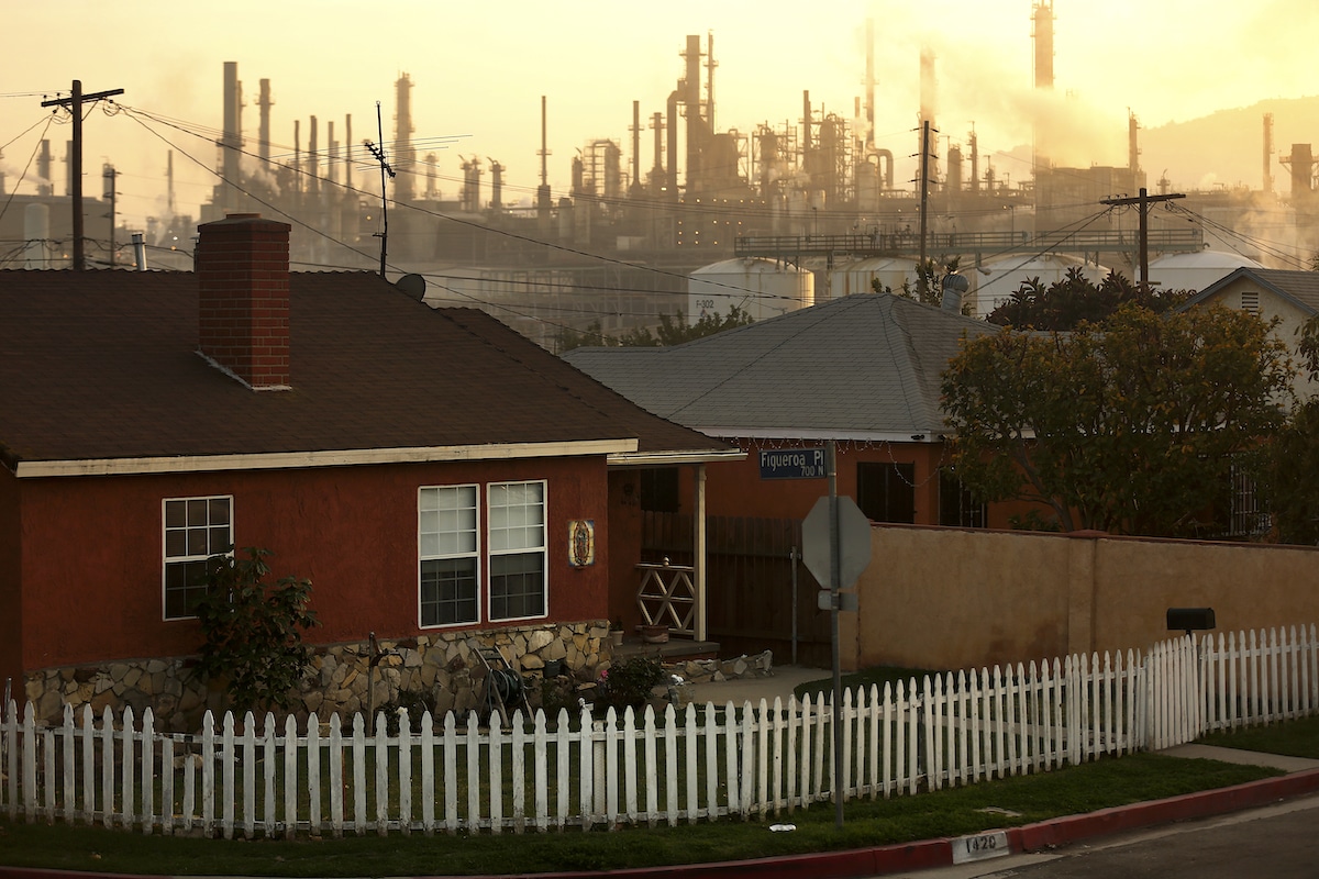 A Phillips 66 oil refinery looms over a Wilmington, California neighborhood.