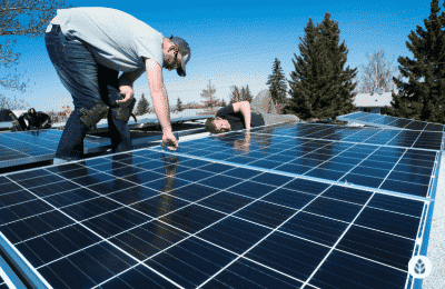 two men checking if solar panels are installed correctly