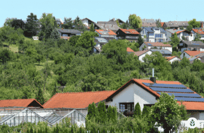hillside neighborhood with solar panels on the roof