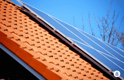 close-up of solar panels installed on brick tile roof