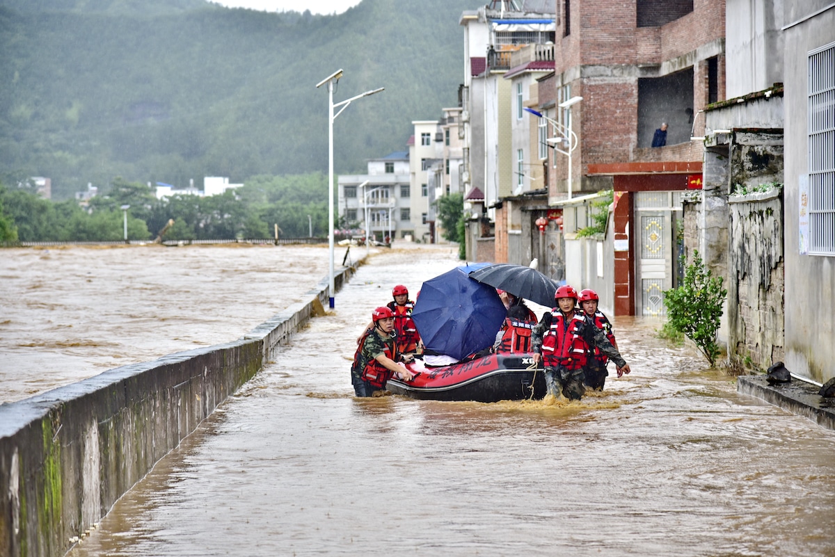 Rescuers evacuate residents from flooding in China