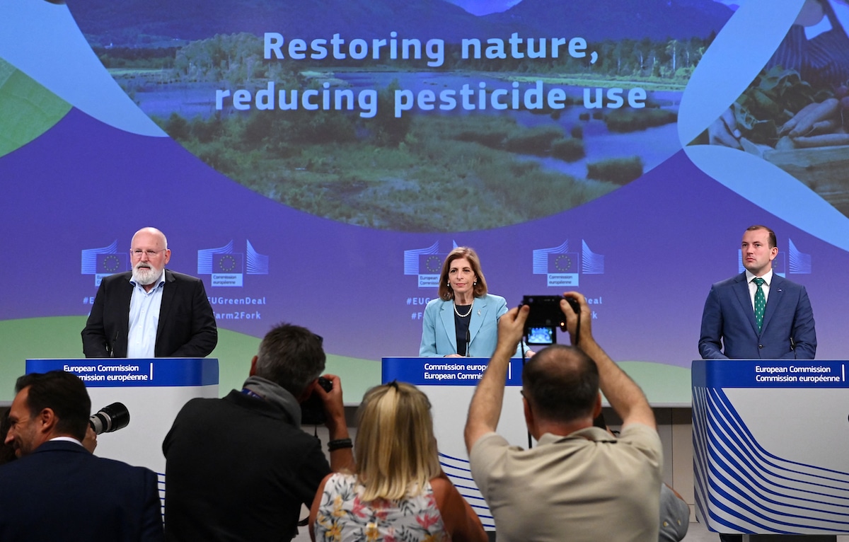EU officials hold a press conference to announce a proposal to reduce pesticide use.