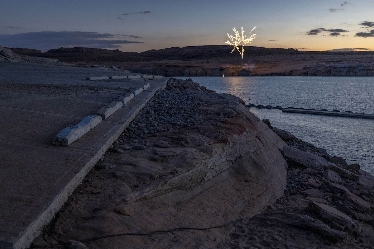 Personal fireworks are launched near the Antelope Point boat launch ramp which was made unusable by record low water levels at Lake Powell