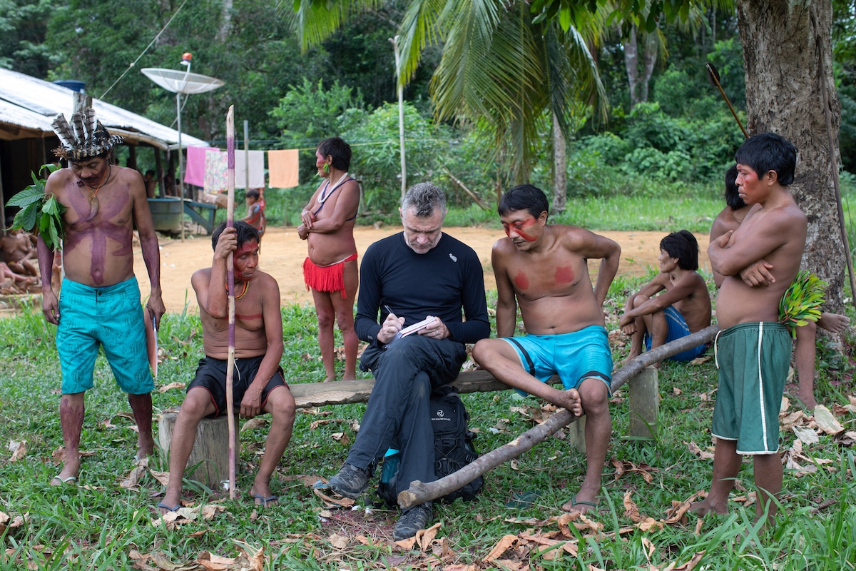 Journalist Dom Phillips talks with Indigenous people in Brazil in 2019.