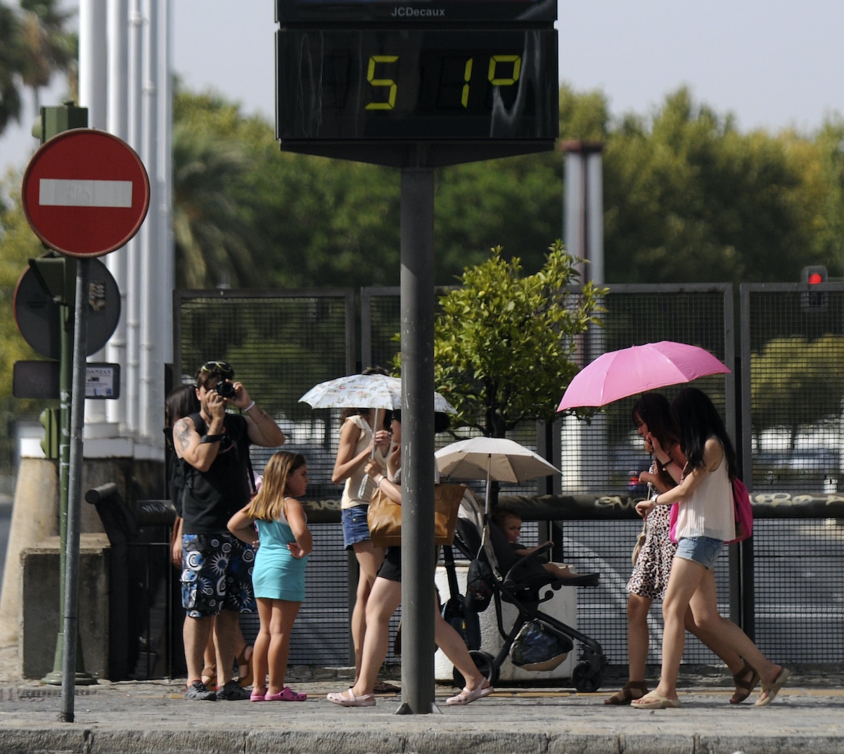During a heat wave, a street thermometer in Seville, Spain shows 51 degrees Celsius