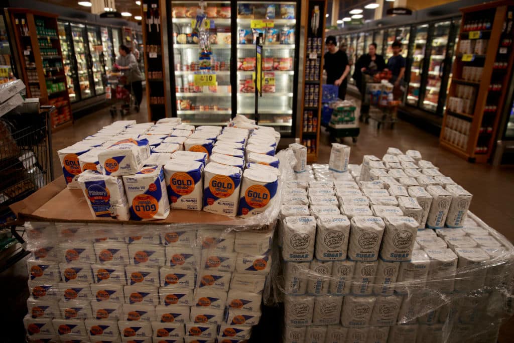 Pallets of flour, and sugar, are for sale at a Kroger in