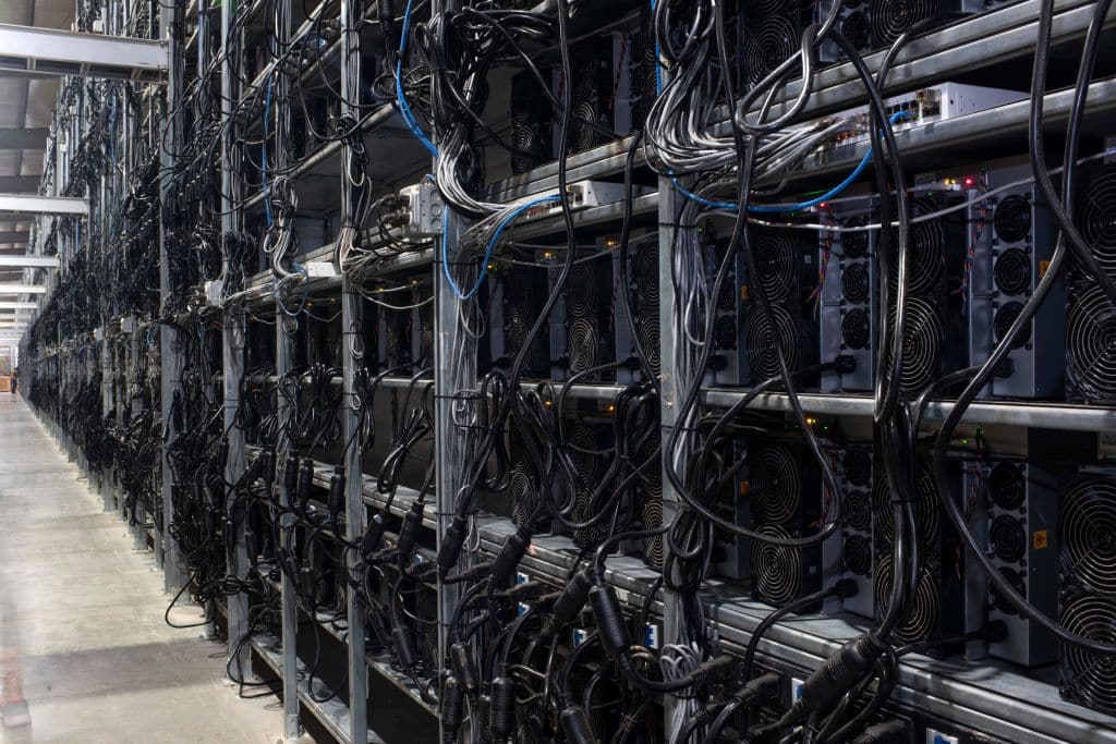 Bitcoin mining machines in a warehou