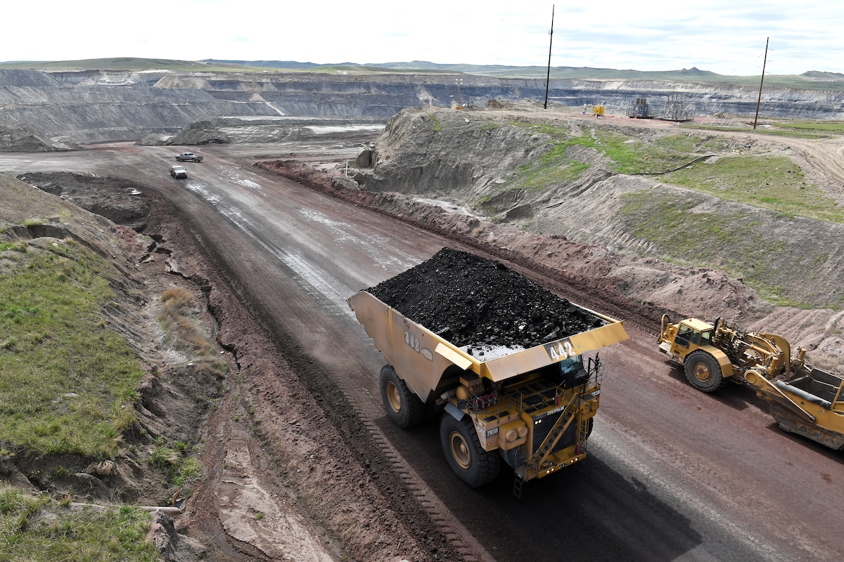 A truck loaded with coal travels down a dirt road at Eagle Butte Coal Mine in Gillette, Wyoming